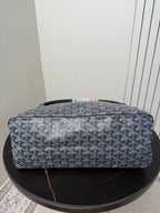 Goyard patterned hobo bag top view, blue-gray canvas with orange accent trim