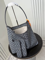 Goyard patterned hobo bag with matching pouch, blue-gray canvas and orange accent