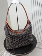 Goyard hobo bag with dark monogram pattern, orange trim, and large open top
