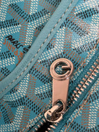 Goyard teal monogram bag zipper close-up with rose-gold hardware