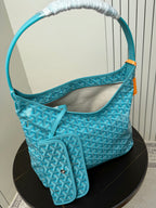 Goyard teal monogram hobo bag with attached pouch and rolled handles