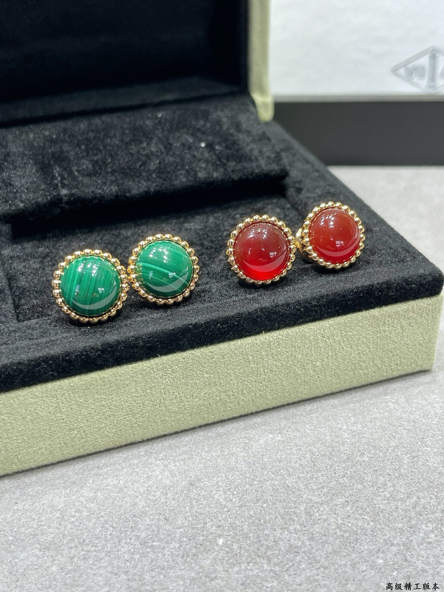 Van Cleef & Arpels earrings, gold-tone studs with green and red round stones