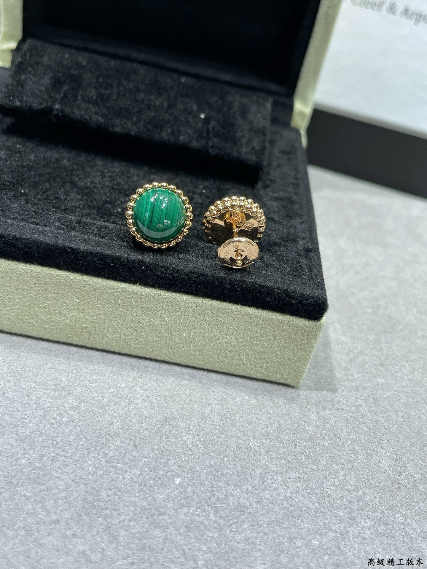 Van Cleef & Arpels earrings, green round stud and gold-tone hoop with emblem