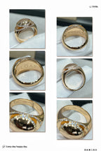 Gold-tone ring set with oval stones, pavé bands, and engraved inner details