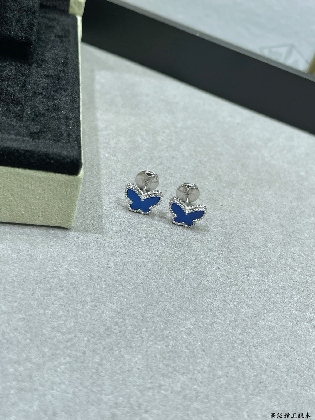 Butterfly stud earrings with blue enamel and silver-tone settings