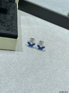 Butterfly stud earrings with blue enamel and silver-tone settings