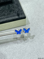 Pair of butterfly stud earrings with blue enamel and clear stone details