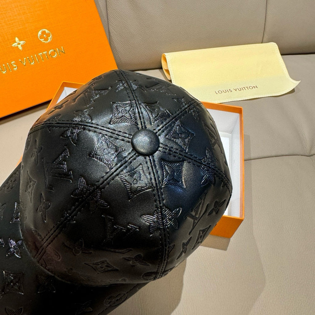Louis Vuitton monogram cap, black embossed leather with domed crown and button