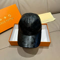 Louis Vuitton monogram baseball cap, black embossed leather with curved brim