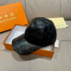Louis Vuitton monogram cap in black embossed leather with curved brim