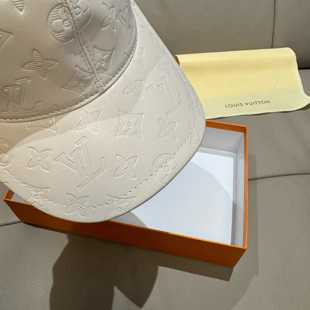 Louis Vuitton white embossed monogram baseball cap close-up on brim