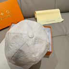 Louis Vuitton white embossed monogram cap with round top button