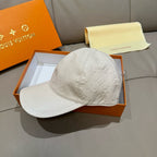 Louis Vuitton white embossed monogram baseball cap, side view