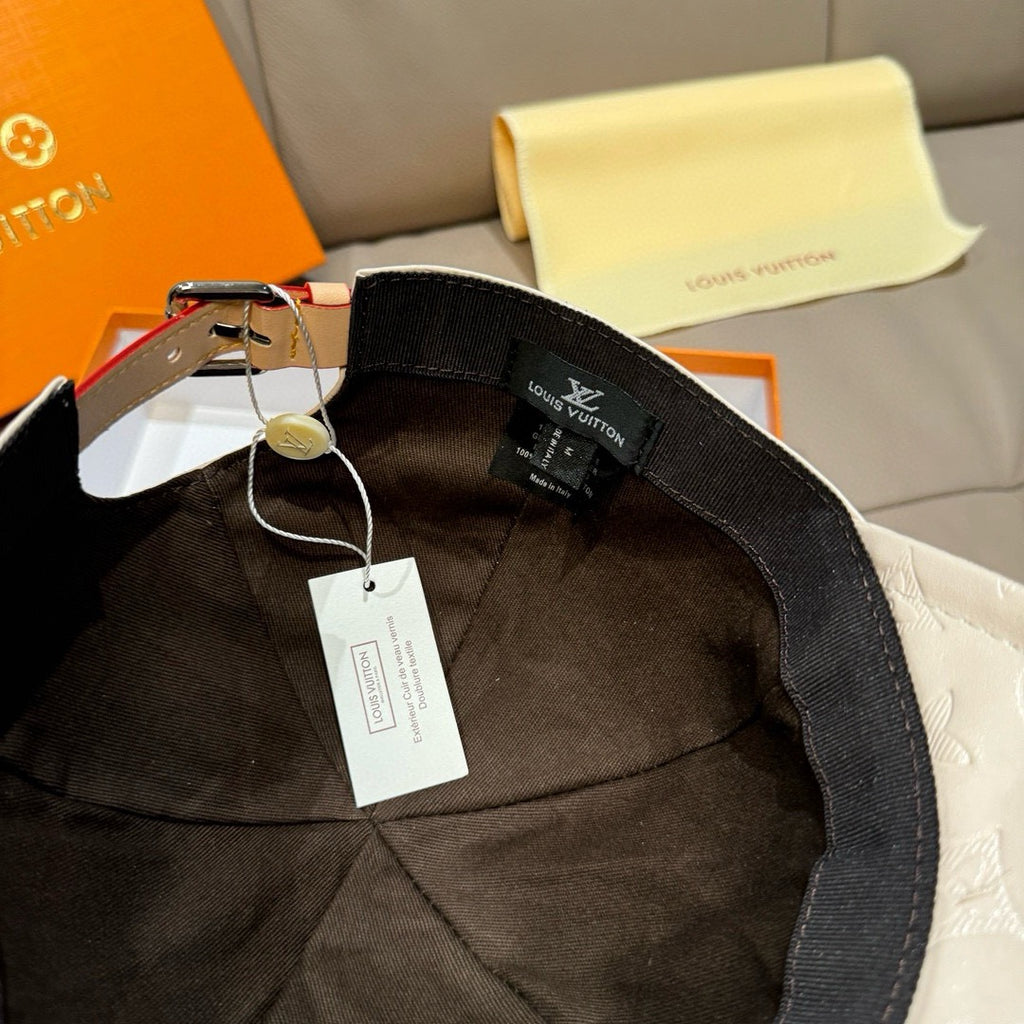 Louis Vuitton black cap interior with adjustable strap and hanging tags