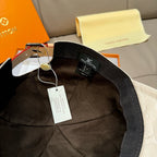 Louis Vuitton black cap interior with adjustable strap and hanging tags