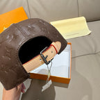 Louis Vuitton cap opening with dark brown leather and adjustable tan strap with metal buckle