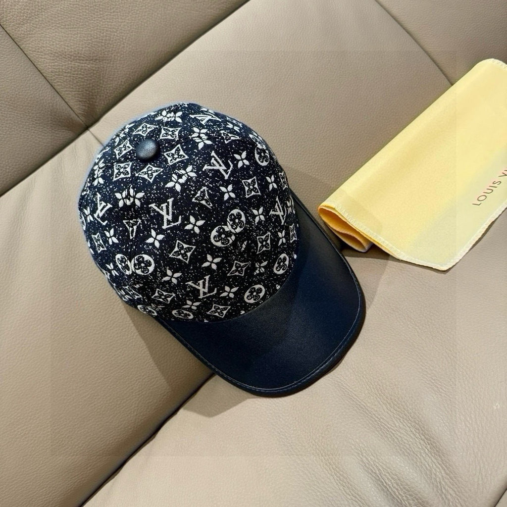 Louis Vuitton baseball cap side view, black monogram print with navy brim and crown.