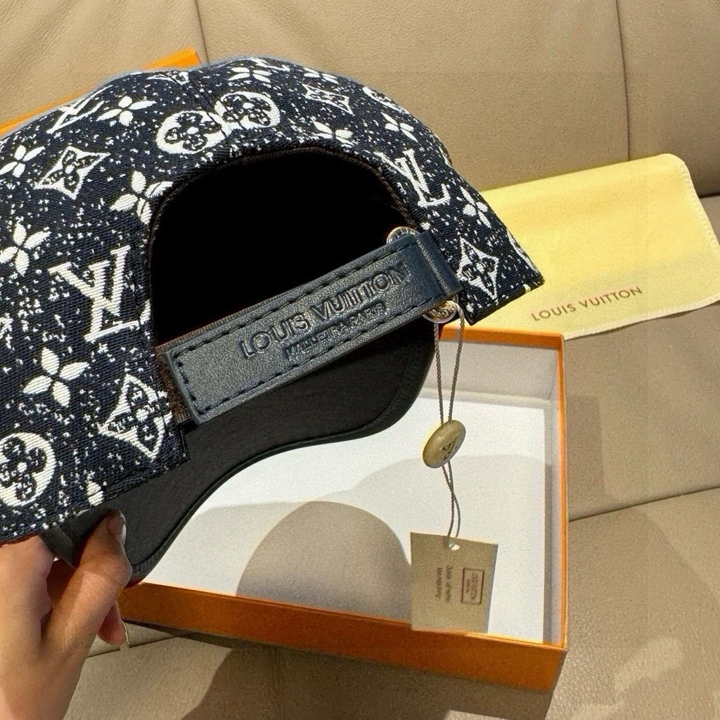 Louis Vuitton baseball cap interior view with embroidered strap and black lining.