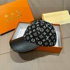 Black monogram-pattern baseball cap with black brim, shown in a side view