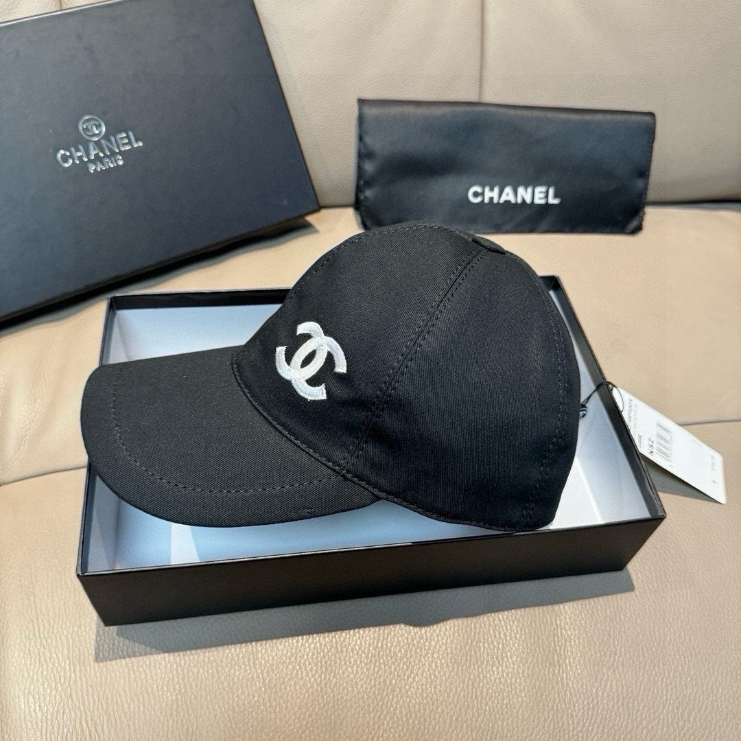 Black satin baseball cap with white CC logo on front and stitched crown