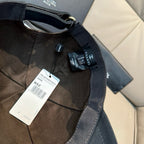 Black fabric cap interior with adjustable strap and Chanel woven label