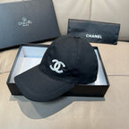 Black satin baseball cap with white CC logo on front, angled view