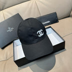 Black satin baseball cap with white CC logo on front, curved brim