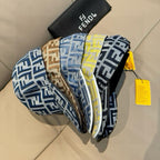 Fendi caps set in blue and yellow FF logo patterns, stacked on display