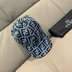 Fendi logo baseball cap in black/white FF monogram pattern.