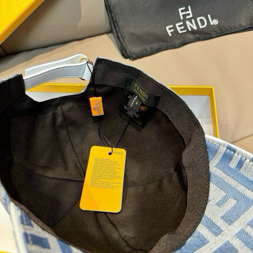 Black-lined interior of blue Fendi FF baseball cap with hanging tags