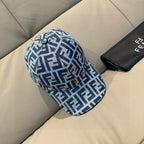 Fendi cap with blue FF monogram pattern and dark button on top