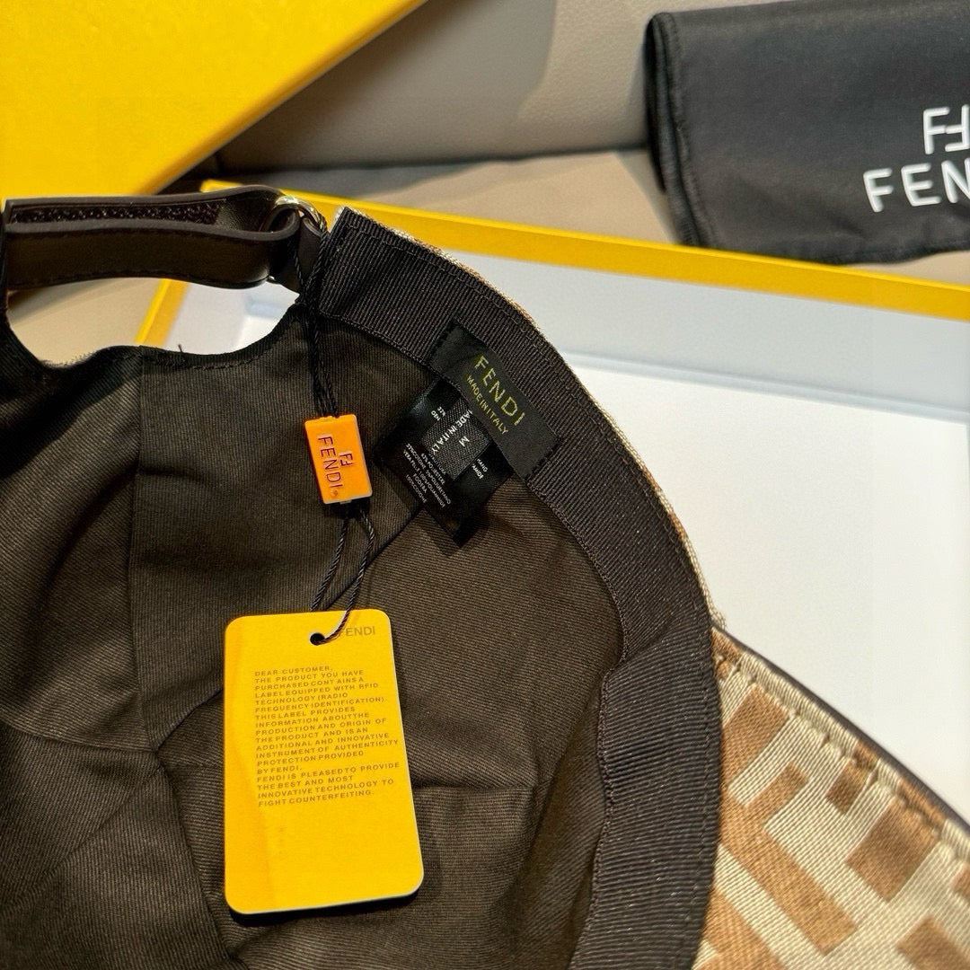 Fendi monogram cap interior with black strap, Fendi tags, and brown FF fabric