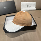 Dior cap with tan monogram crown and white brim, small top button.
