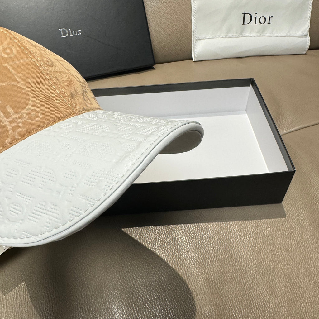 Dior cap close-up of white brim with cutout vent detail.