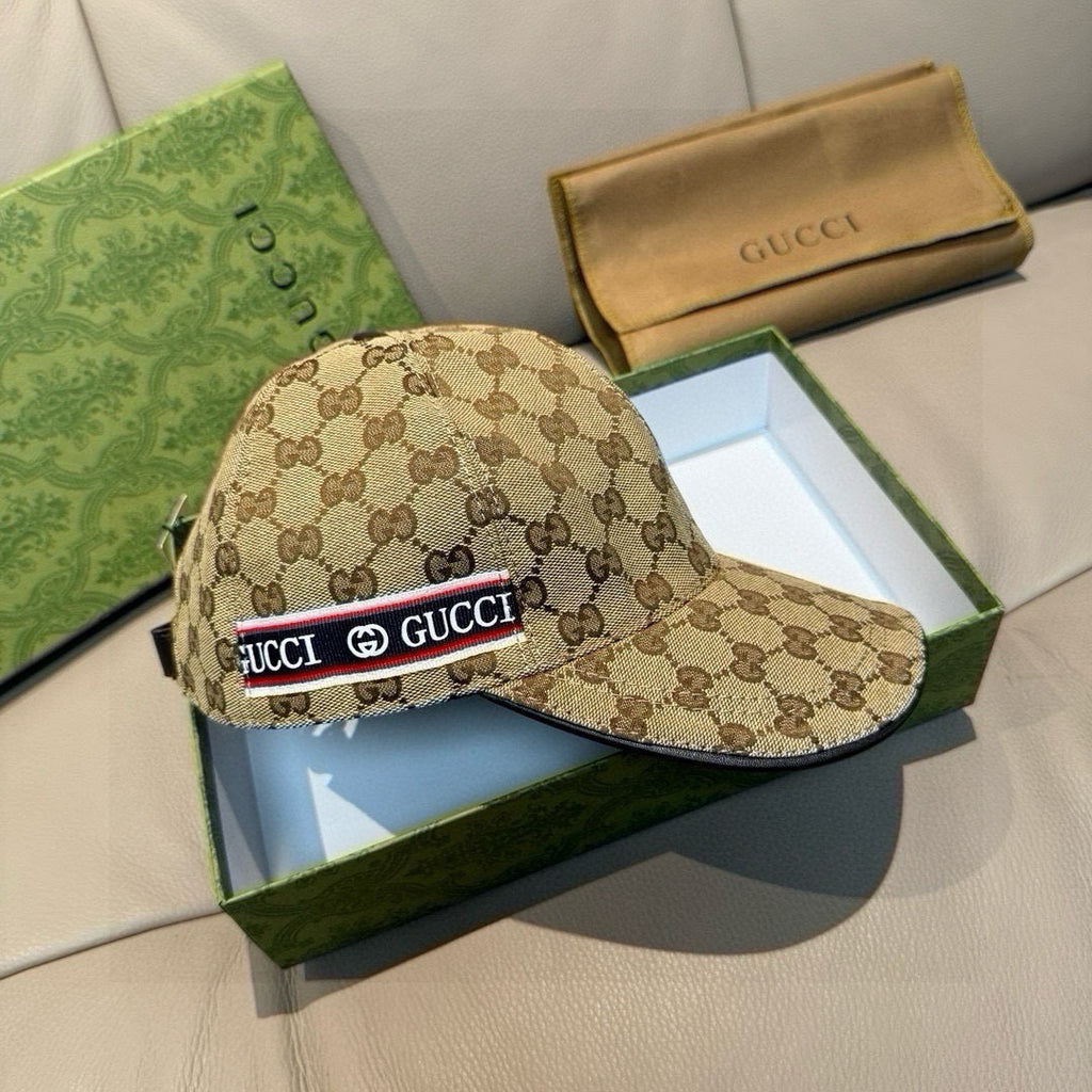 Gucci baseball cap with brown GG monogram pattern and logo stripe on the front.