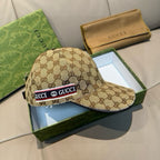 Gucci baseball cap with brown GG monogram pattern and logo stripe on the front.