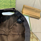 Gucci baseball cap side view with black inner panel and size label near the strap.