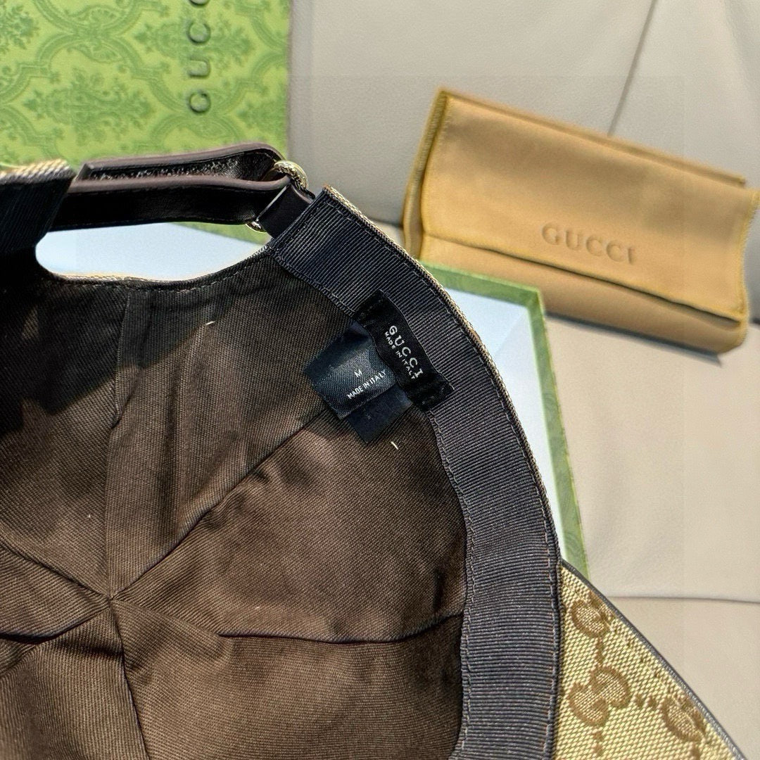 Gucci baseball cap side view with black inner panel and size label near the strap.