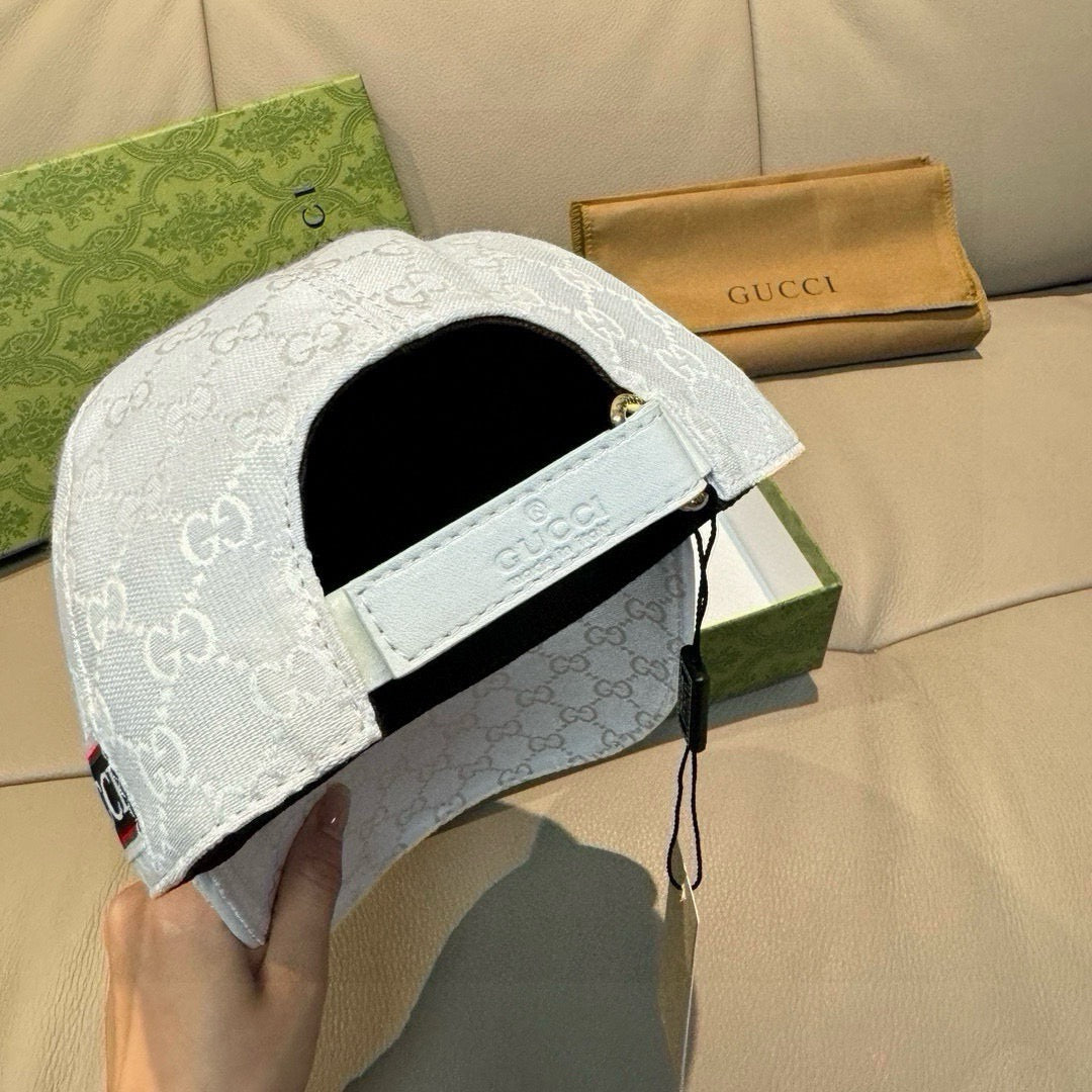 Gucci baseball cap back view in white GG monogram with adjustable strap and black lining.