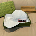 Gucci baseball cap in white GG monogram fabric with curved brim and logo trim band.