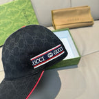 Black Gucci baseball cap with GG monogram texture and red-edged logo band