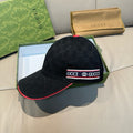 Black Gucci baseball cap with GG pattern and red-trim logo band