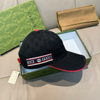 Black Gucci baseball cap with GG monogram print and red underbrim trim
