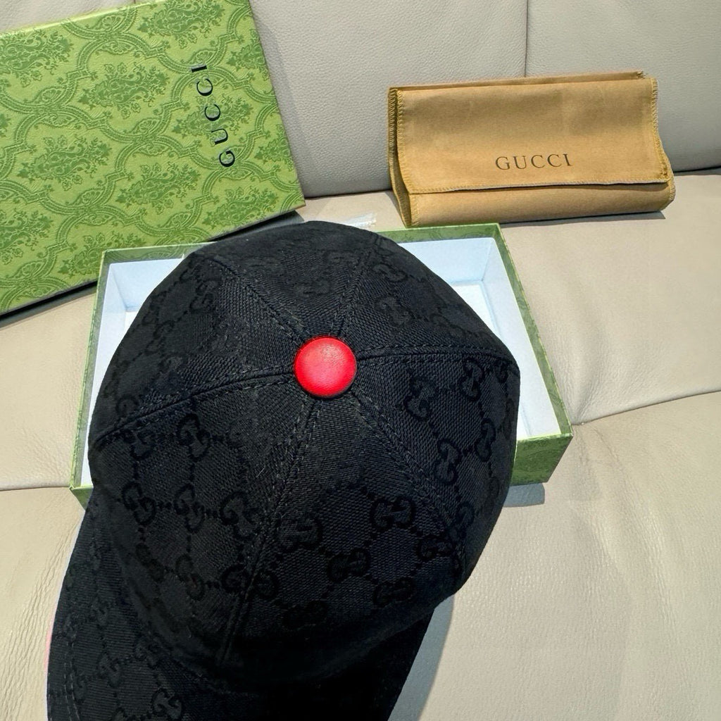 Black Gucci baseball cap with tonal GG monogram and red center top button