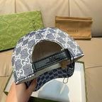 Gucci GG-print baseball cap side view with black adjustable strap and brim