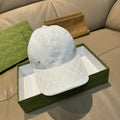 Gucci cap in white GG monogram canvas, curved brim, gold eyelet detail