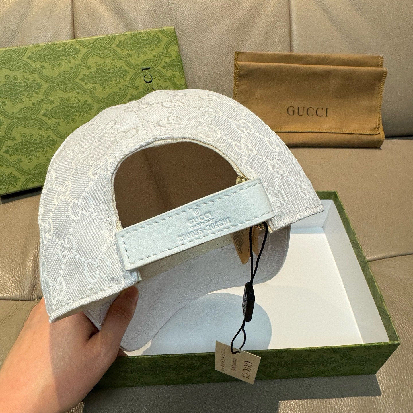 White GG monogram cap with adjustable strap, curved brim, interior view