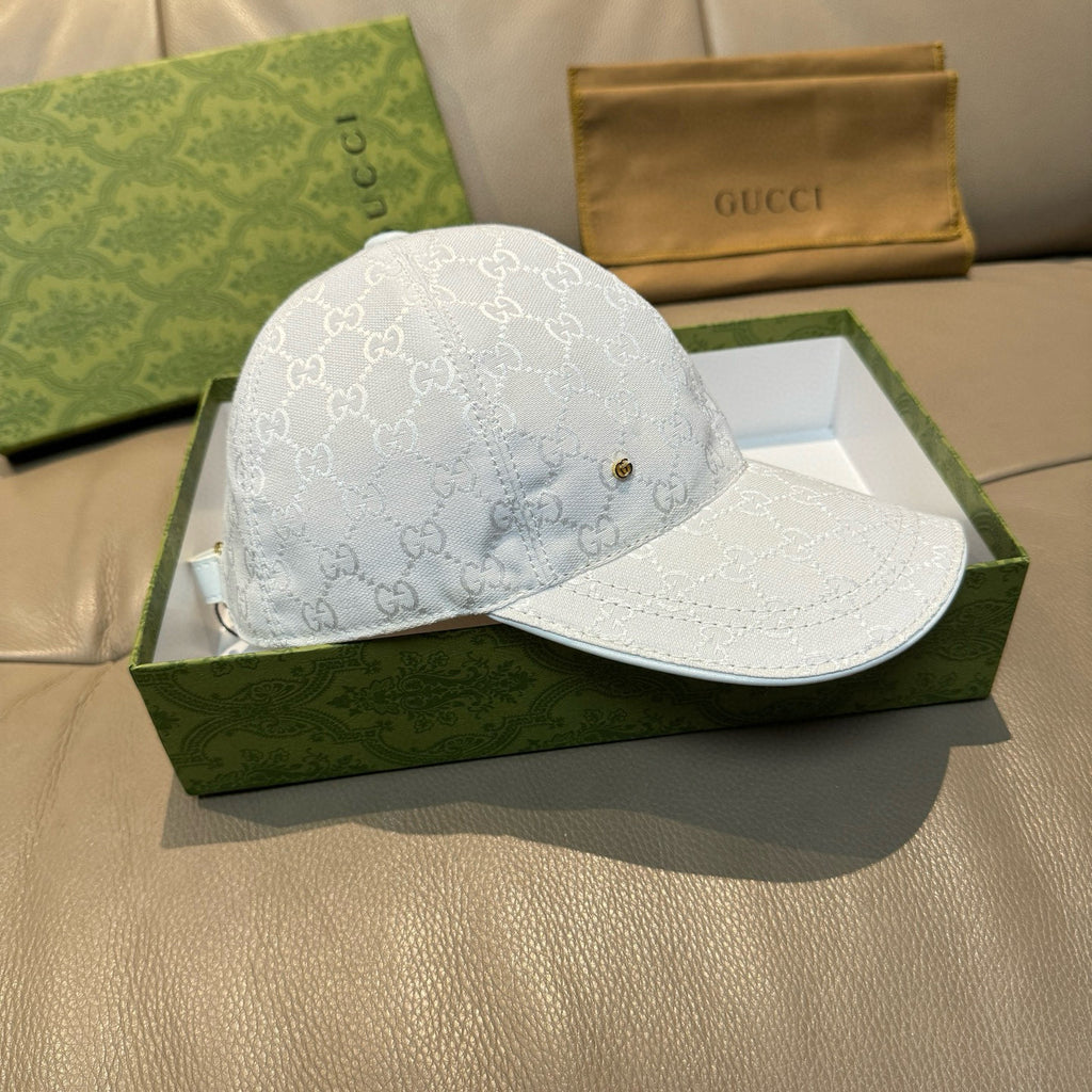 White GG monogram cap with curved brim and front gold emblem
