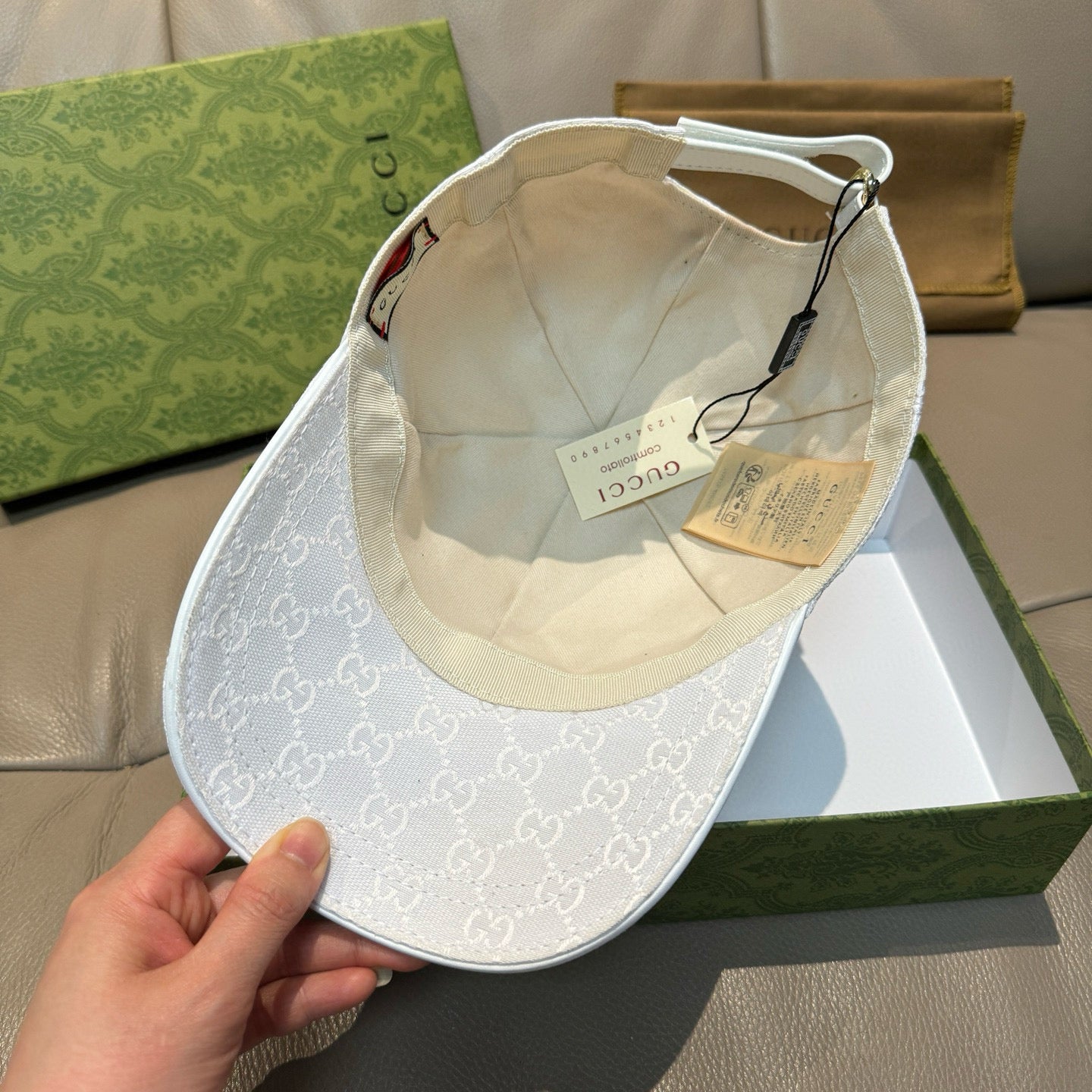 White GG monogram cap interior with stitched lining and adjustable strap