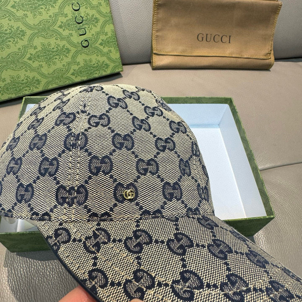Gucci blue GG patterned cap, angled view showing repeating monogram